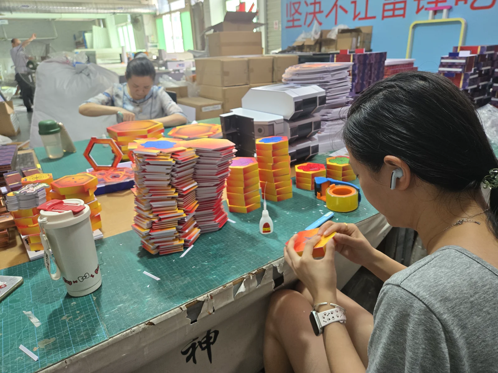Workshop photograph: display components being assembled by hand.